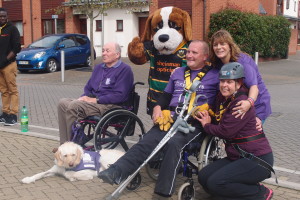 Staff involved with abseil and Saints mascot at Northampton Lift Twoer