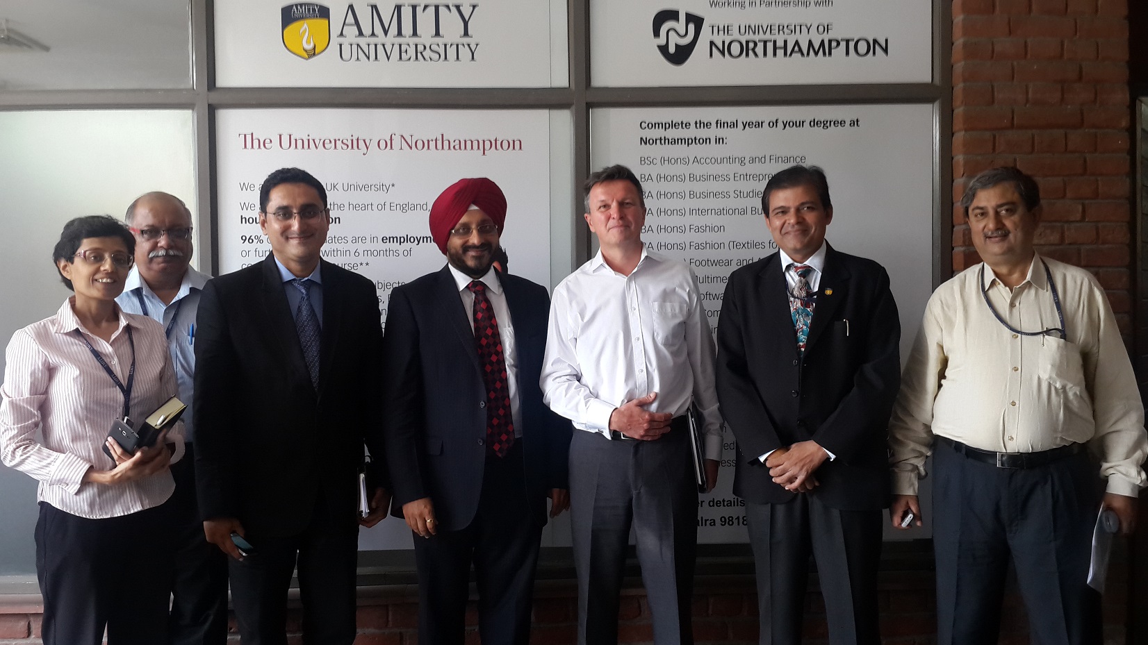 Amity University staff in their new office