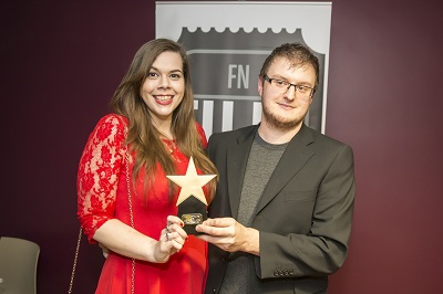 Charlotte Carne and Chris Anderson receiving the award