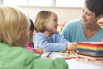 Class teacher with young pupil