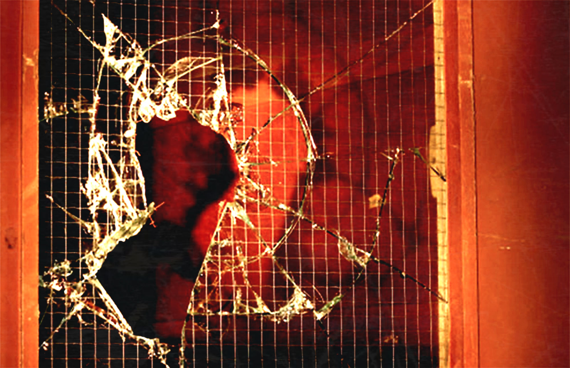 A smashed window at a crime scene