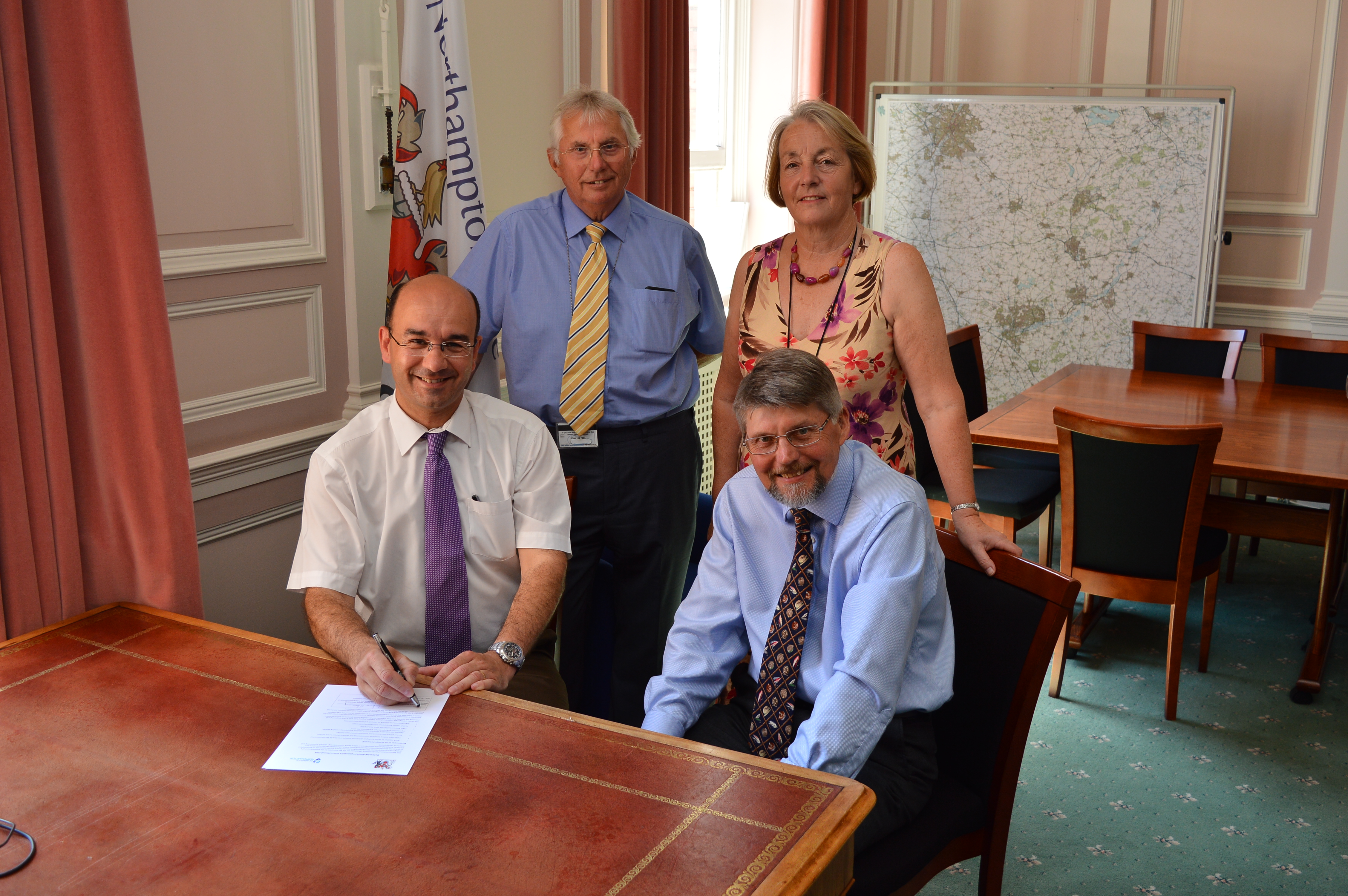 Simon Denny and Cllr Andre Gonzalez De Savage signing the MoU