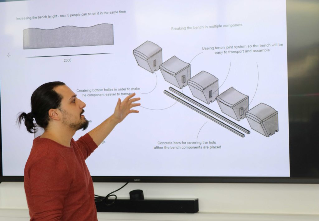 Image of Stefan Ionita presenting his concept to the panel.
