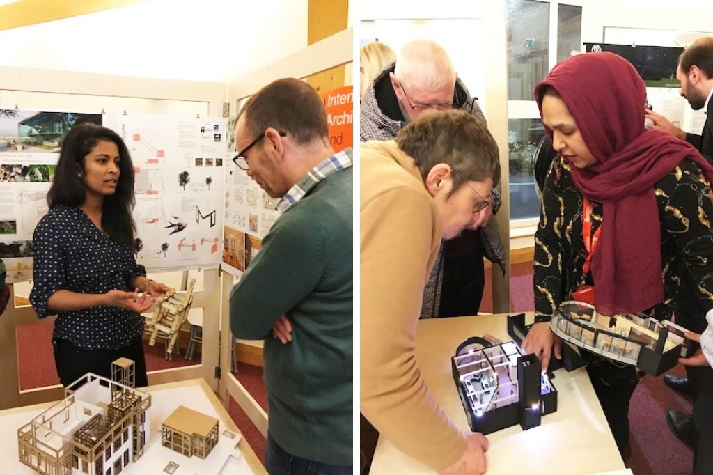 Students explaining their concepts to people at the presentation evening.