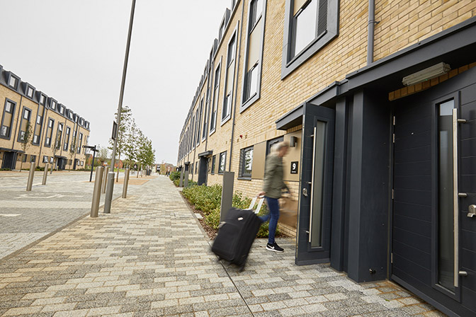 Blurred out image of someone entering student accomodation