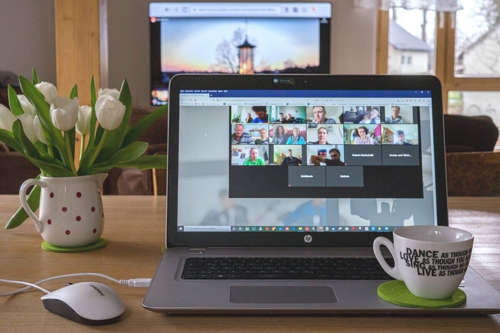 Laptop and cup online meeting