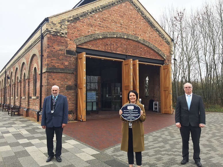 Pictured from left outside the Engine Shed, Terry Neville UON Chief Operating Officer, Becky Bradshaw, Director of Estates & Campus Services with the heritage award and Simon Badcock, Project Manager.