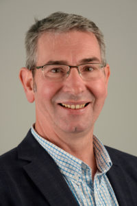 Headshot of John Sinclair, dean of faculty of art, science and technology