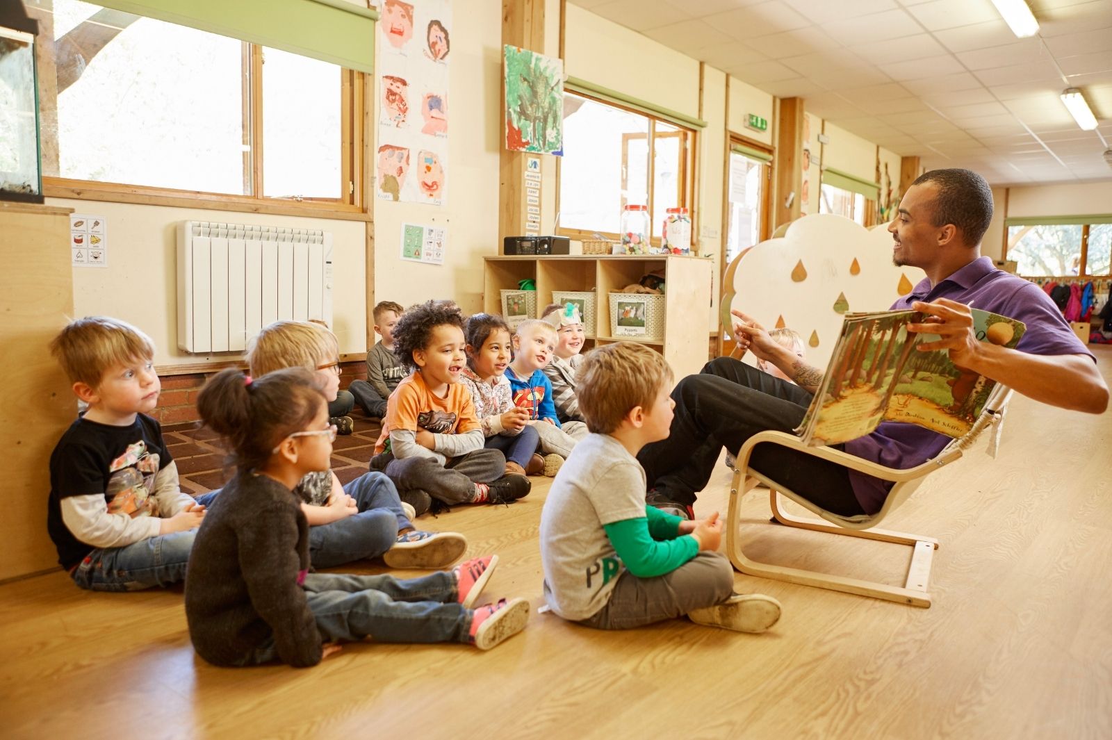 Early Years teacher reading book