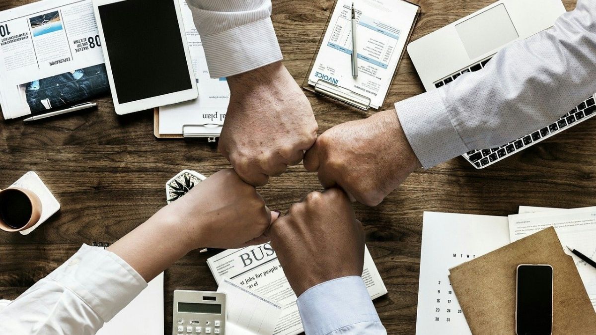 Teamwork office fist bump