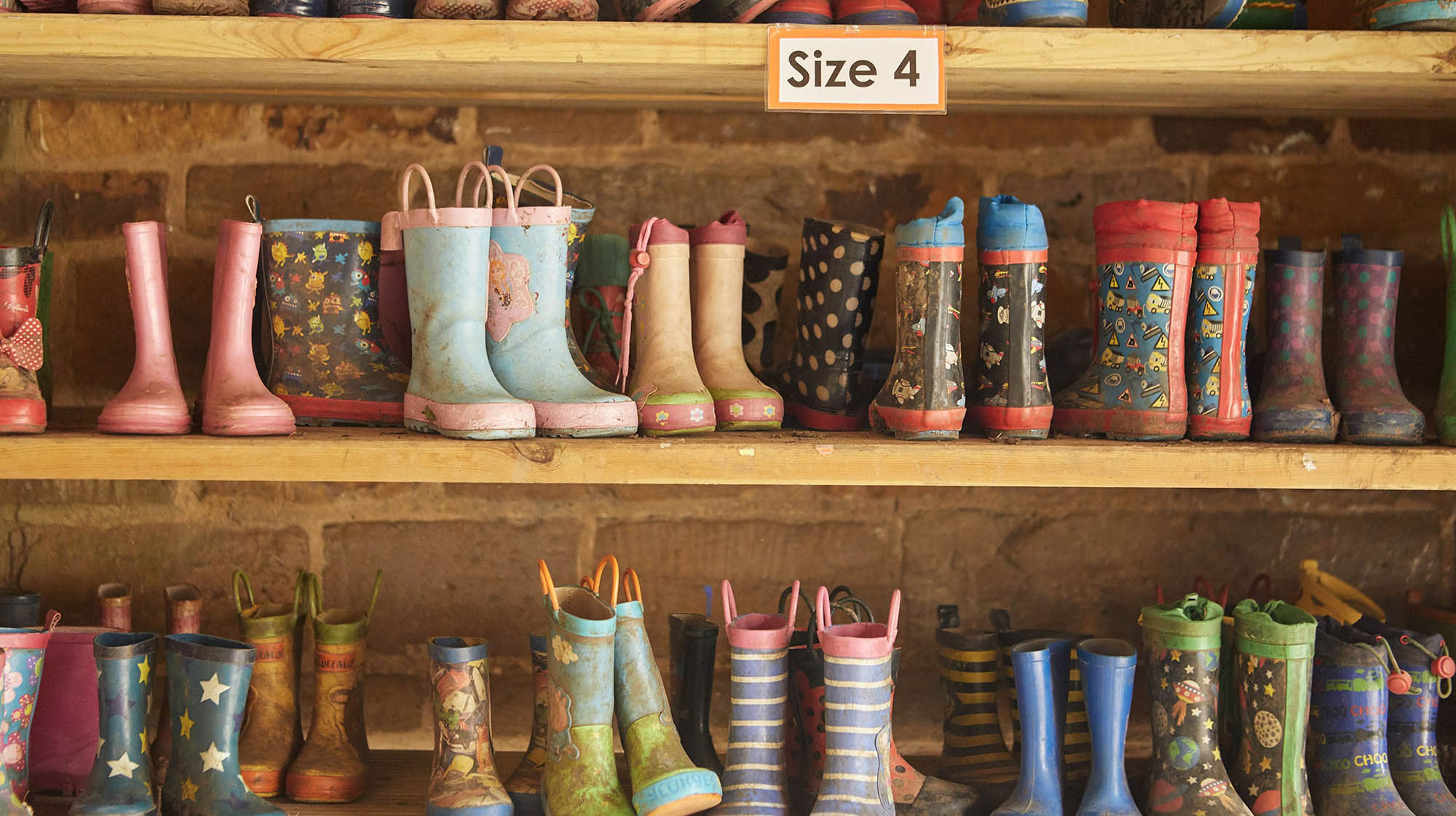 Children's wellington boots on shelf