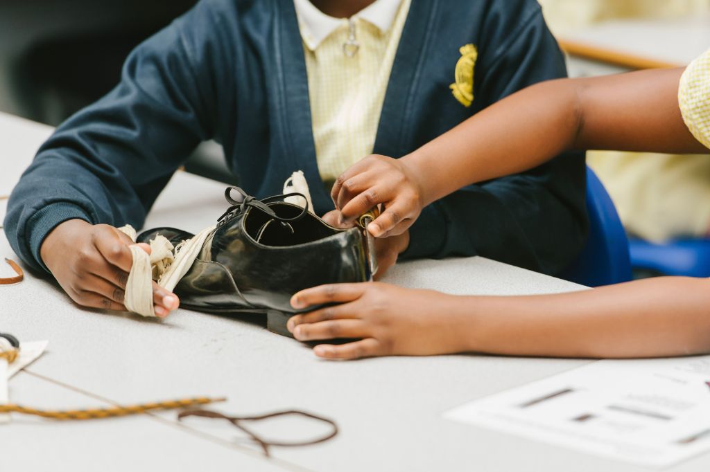 Two BAME children learning