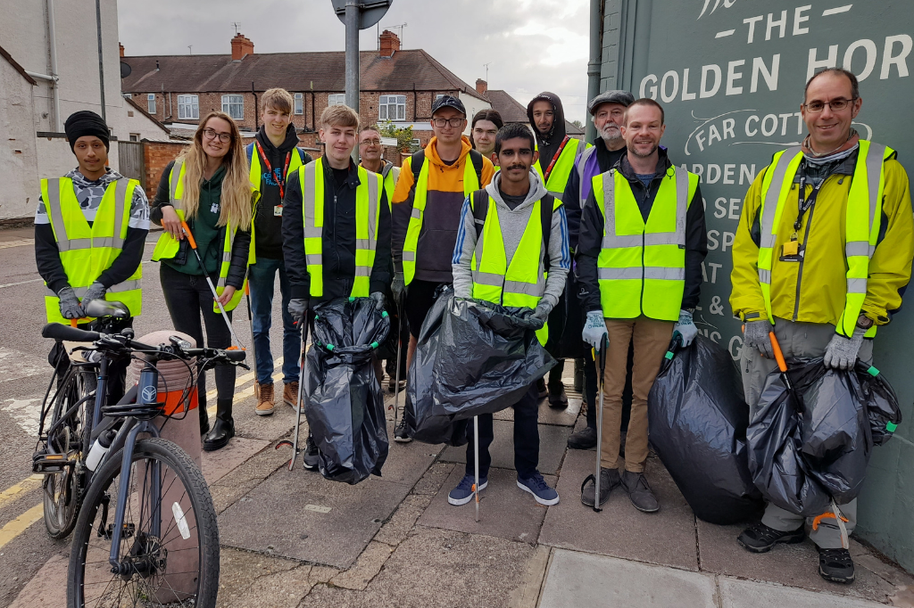 Group of students with litter picking rubbish sacks