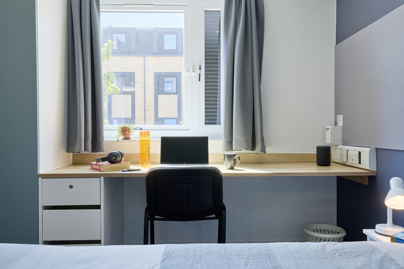 A desk in front of a window in a Townhouse bedroom at Waterside campus
