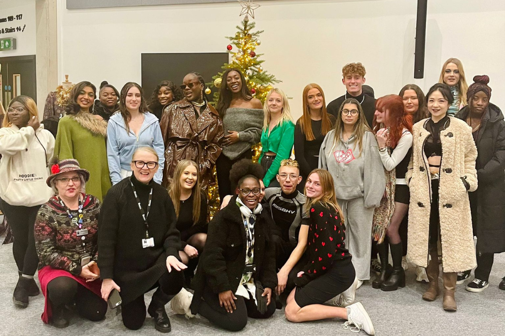 Group photo of Fashion Marketing students next to Christmas tree