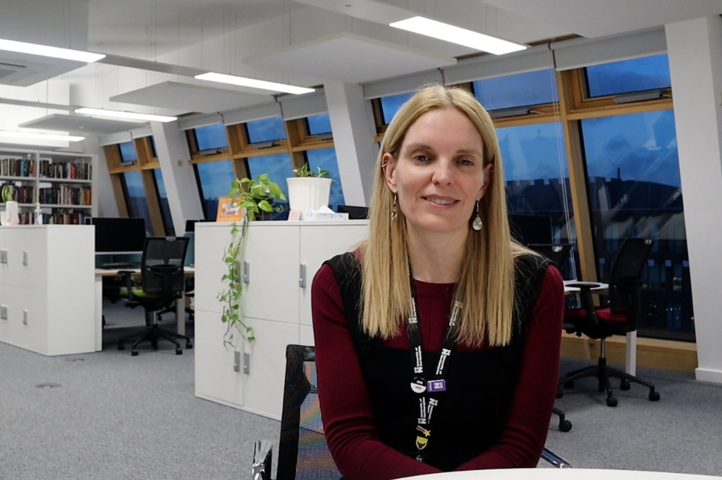 Anne-Marie on seat in office.