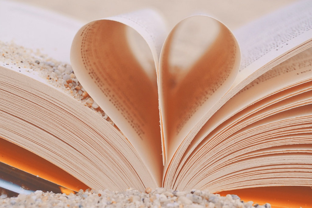Book pages folded into love heart.