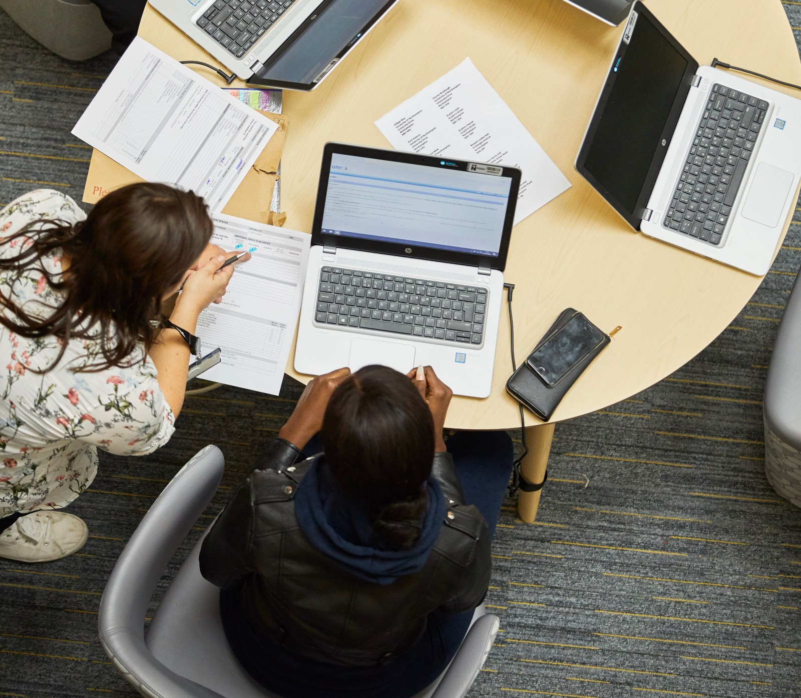 Students learning laptops.