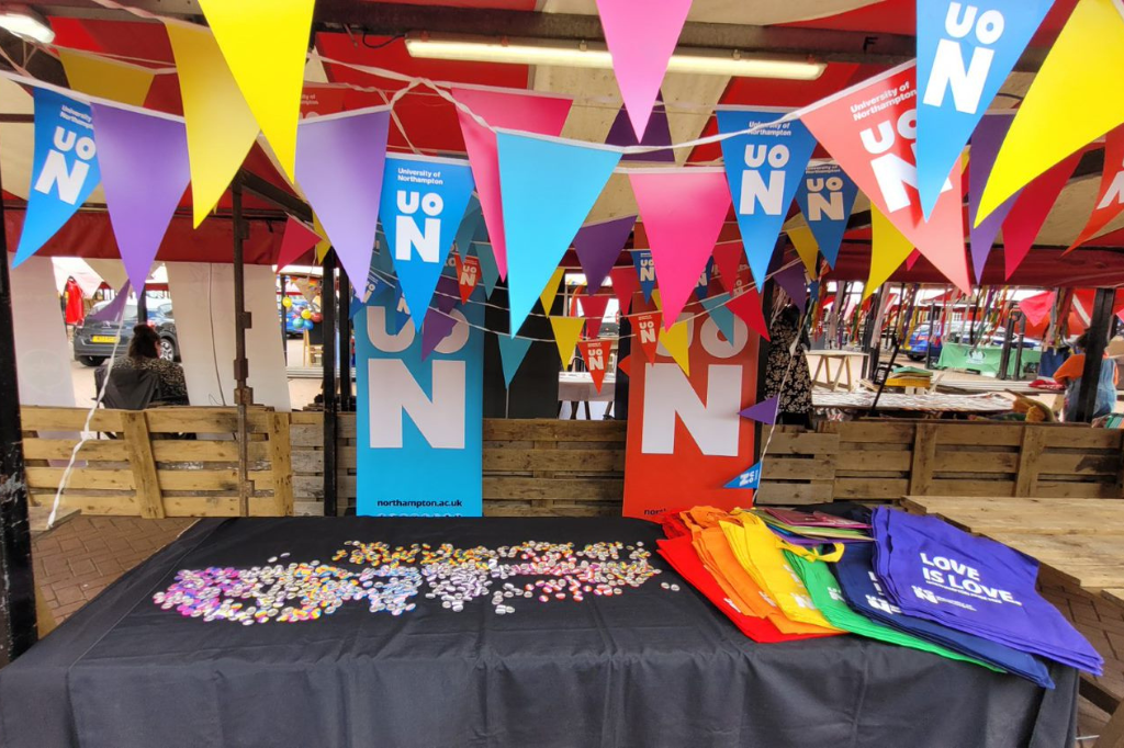 Rainbow buntings and banners with UON logo