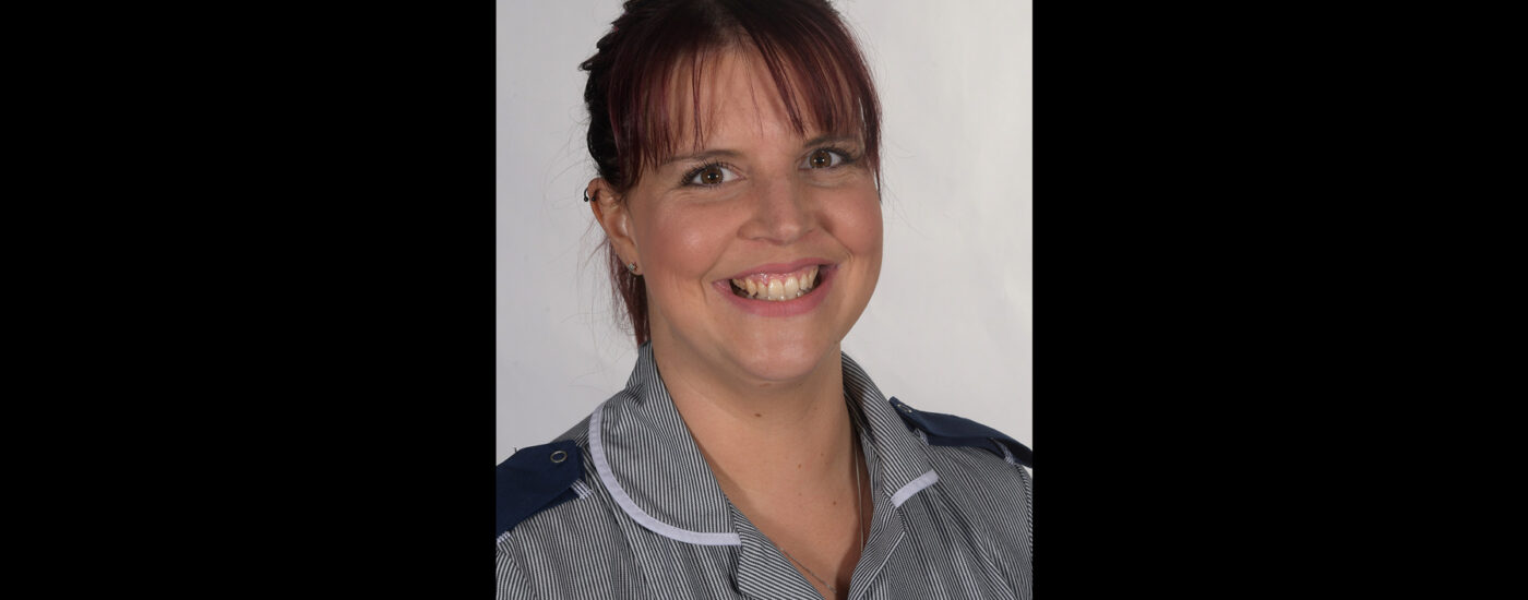 Charlotte Kenny, Adult Nursing BSc (Hons) student. Charlotte is wearing her Nurse uniform in a professional taken photo.