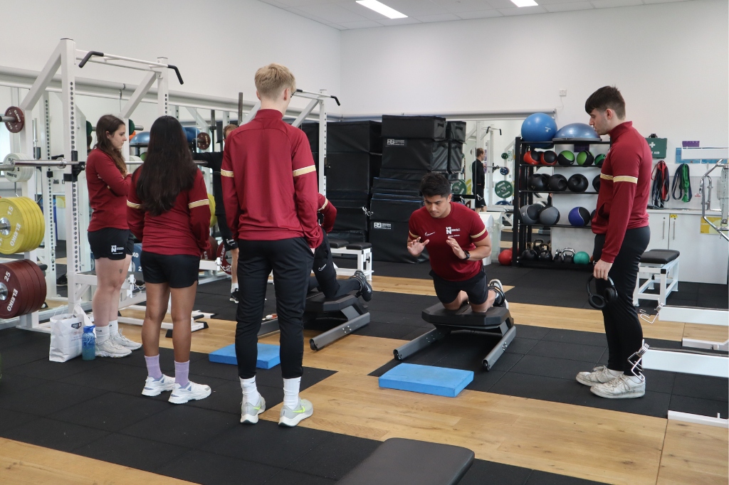 Elite Athlete Scholars work out in gym facilities.