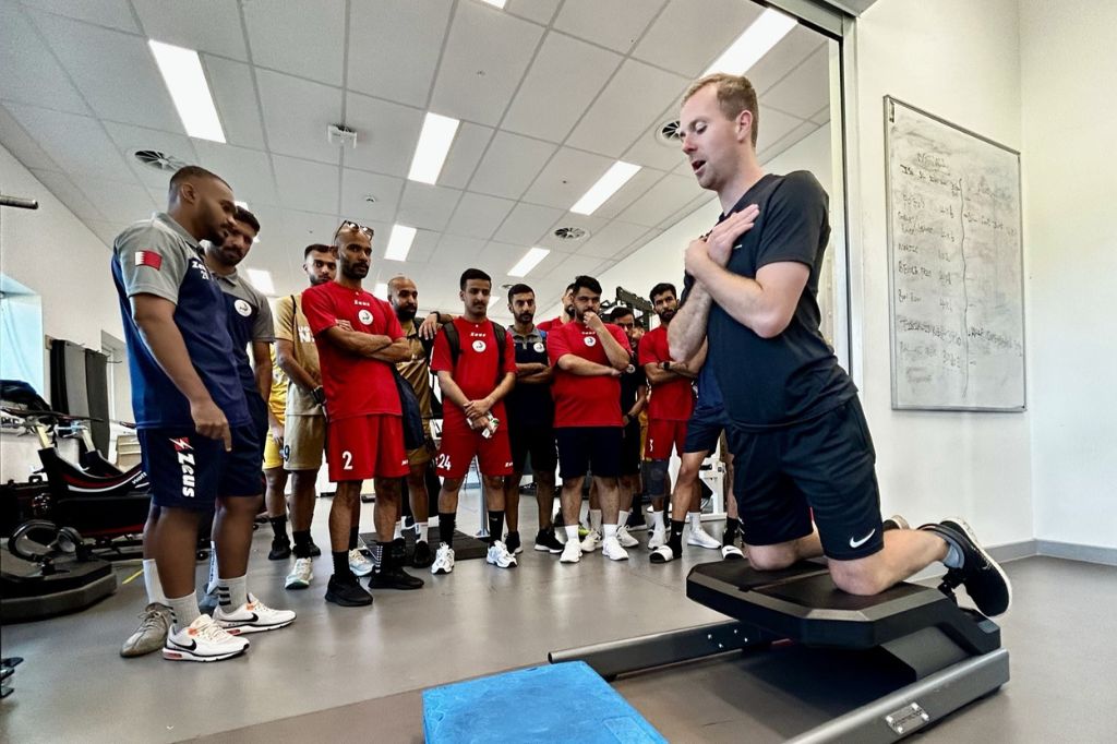Sports Scientist Luke Callis demonstrates strength test to the Gulf University Football Team.