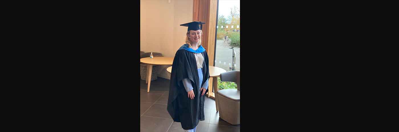 Geography BSc graduate Ellie Smith is photographed wearing her graduation gown and mortarboard on her graduation day at the University of Northampton