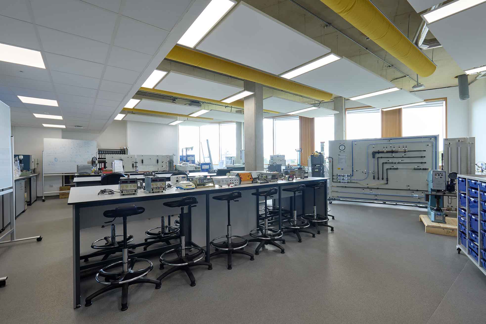 A photograph of the Engineering Laboratory at the University of Northampton - there is a laboratory workbench in the foreground, and floor-to-ceiling windows in the background