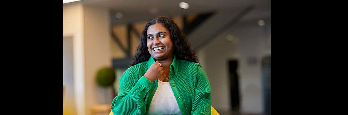 A photograph of UON graduate Mirusha Jagatheeswaran taken in the Learning Hub at the University of Northampton