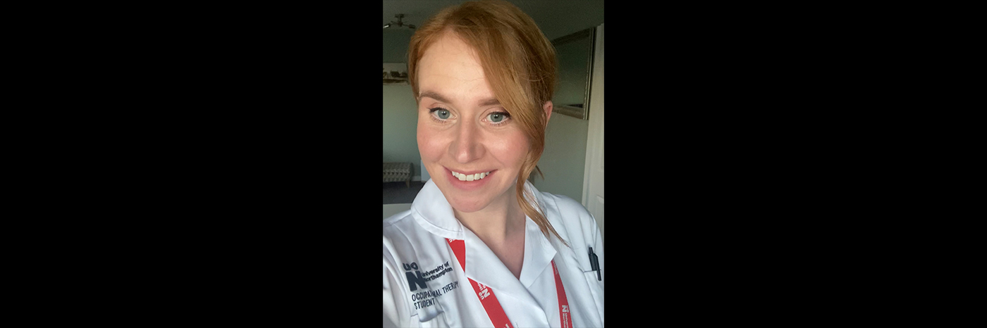 Jennifer Larratt, who is an Occupational Therapy BSc graduate, is pictured in a head and shoulders shot. Jennifer is wearing a student occupational therapy uniform and red lanyard