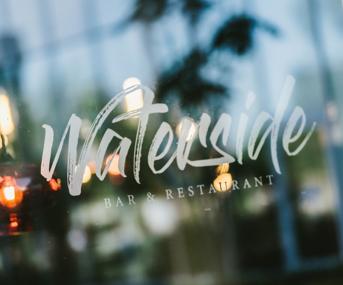 The sign for the Waterside Bar and Restaurant on a external window.