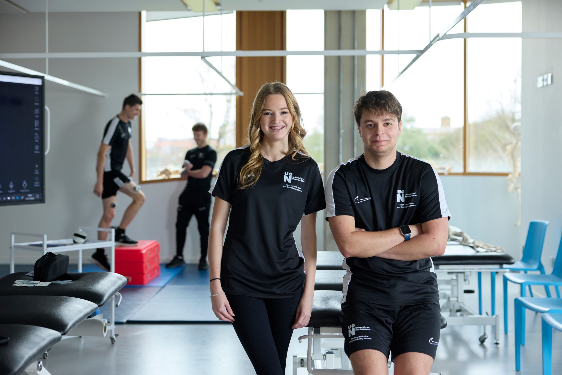 Two sports rehabilitation staff stood inside our cutting edge facilities.