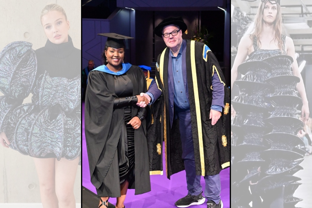 A graduate in a cap and gown shakes hands with an official in academic regalia on stage during a graduation ceremony.