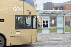 A stagecoach bus in gold parked at the Waterside bus stop on Park Avenue