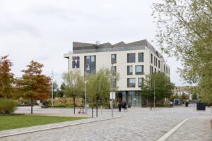 Image of the Senate Building on an overcast day with greenery around.