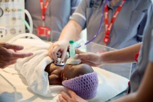 A baby mannequin is resuscitated during a demonstration on the Children and Young People's Nursing course.