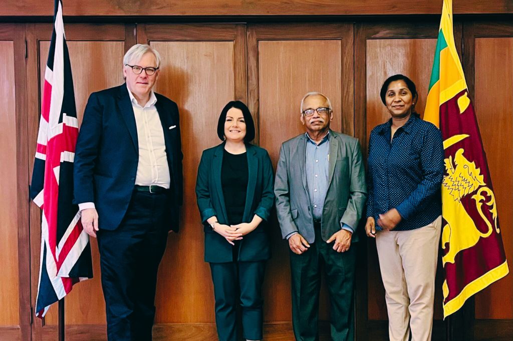 Flanked by the Union flag to right and Sri Lankan flag to the left, the British High Commissioner Andrew Patrick stands alongside UON Deputy Vice Chancellor and COO Becky Bradshaw and UNISTEM's CEO Gihan Talgodapitiya and COO and Wathsala Nanayakkara.