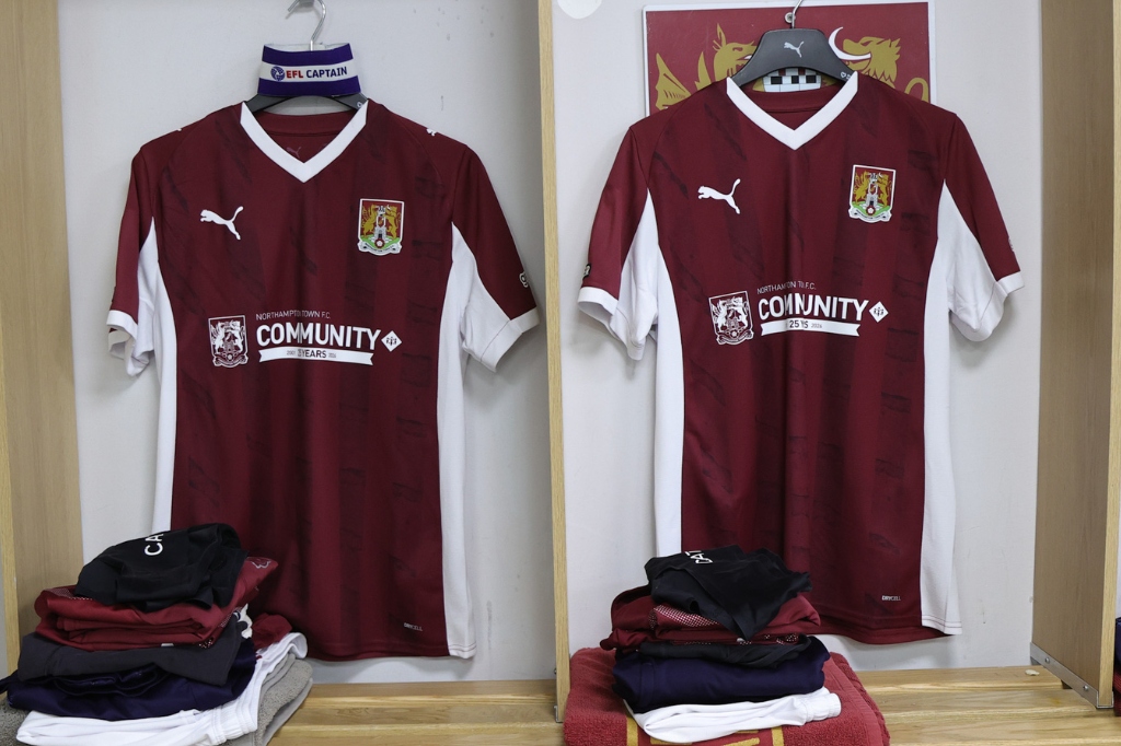 Two football shirts hung in kit room at NTFC.