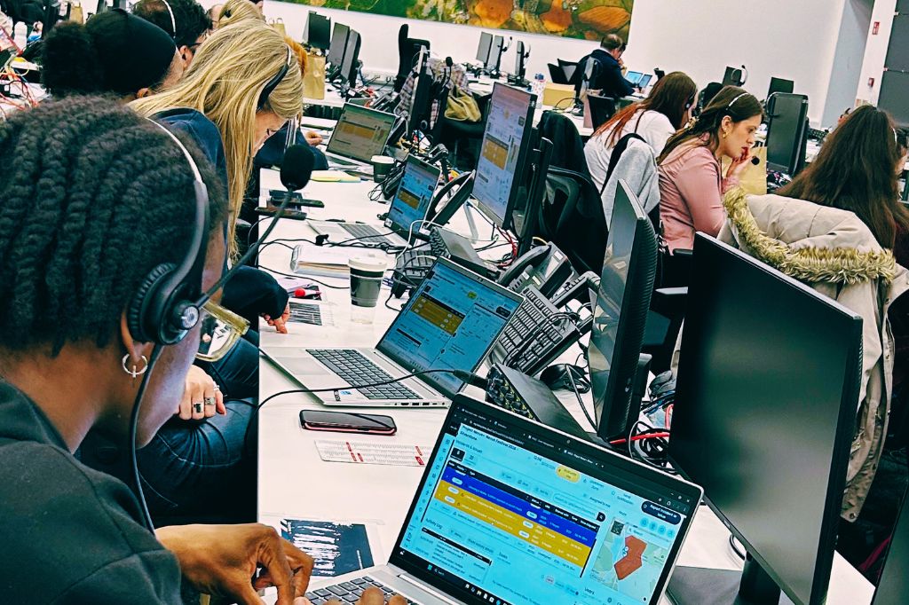 UON Students sat a rows of computer monitors at the Silverstone Event Control Room.