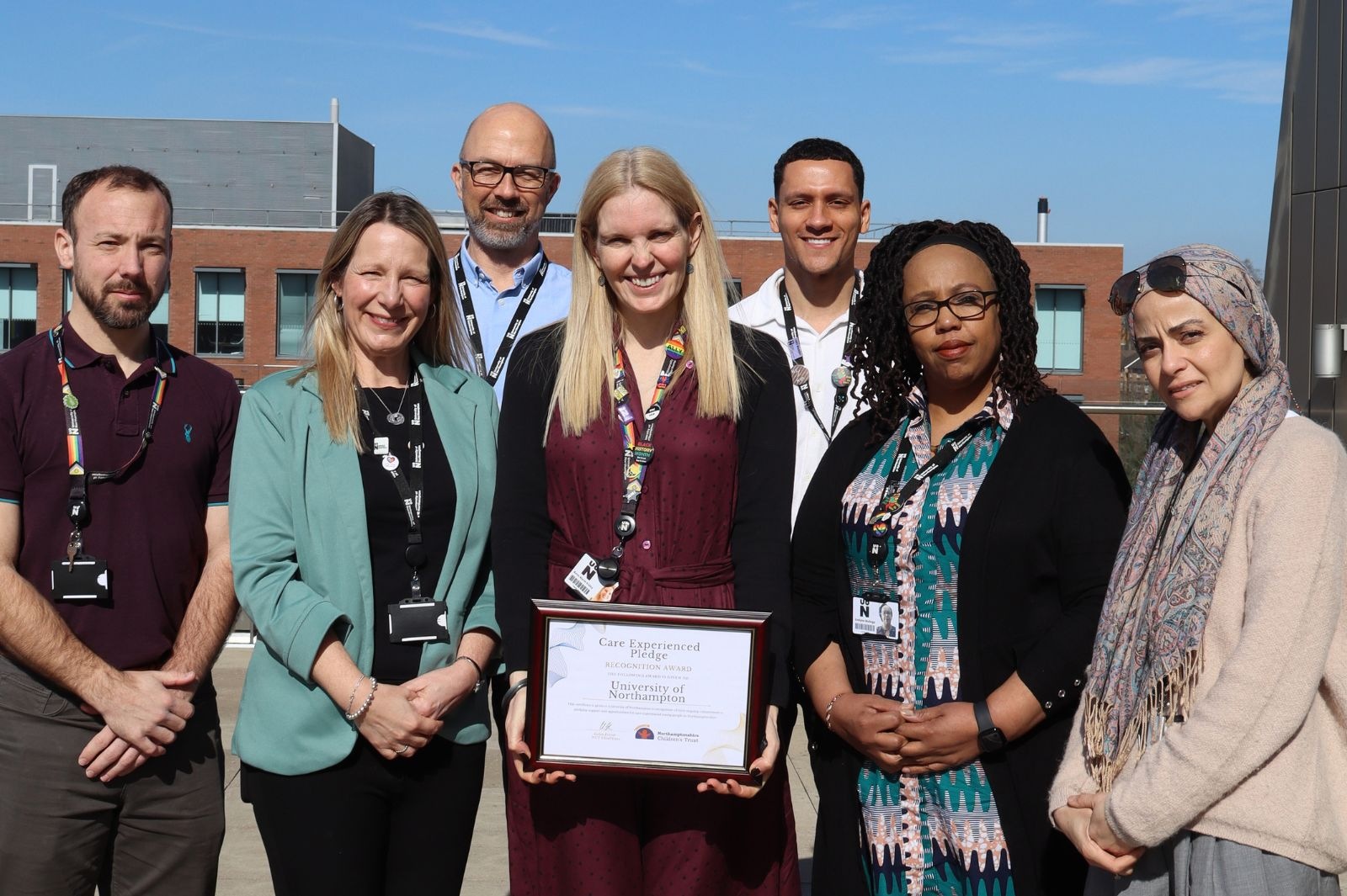 Vice Chancellor Professor Anne-Marie Kilday is pictured with members of the team behnd the University's Care Leavers Pledge, a copy of which is held by Anne-Marie. Also pictured are Liam Norton, Tim Dobson, Kahvan Bryan, Evelyne Mulinge and Claire Parsons.