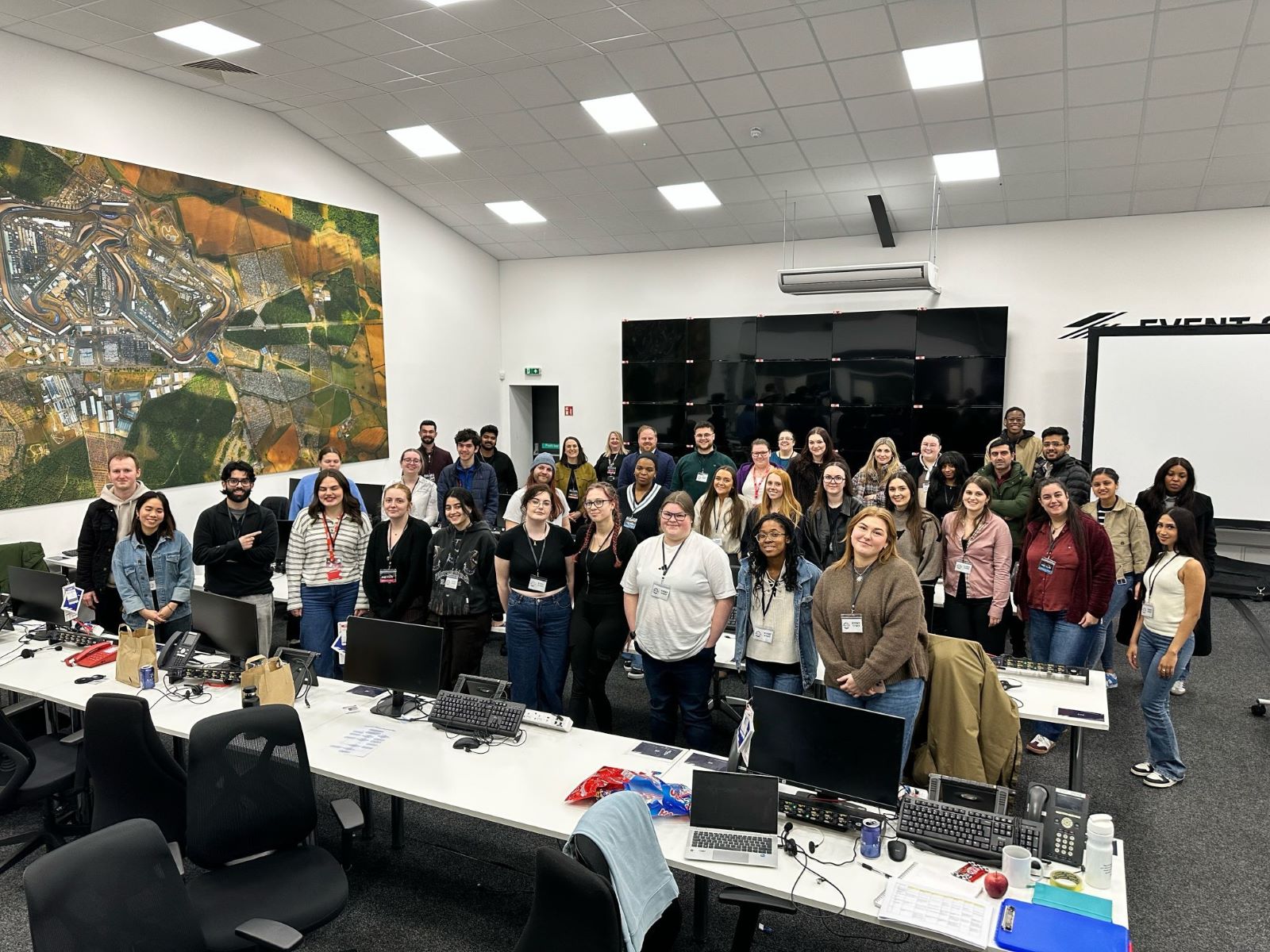 A large group of students stand in a operations room during Operation Nexus+ event in March 2026.
