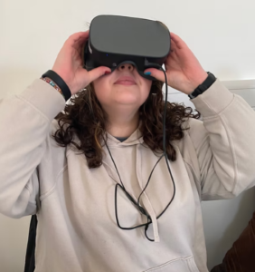 Student Beth wears a virtual reality headset.