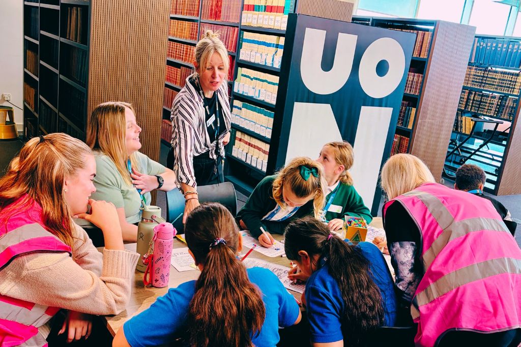 Dr Laura-Jane Devanny, Senior Lecturer in Education (standing) oversees a table of primary school children take part in a poetry challenge at the Big50 Book Festival.