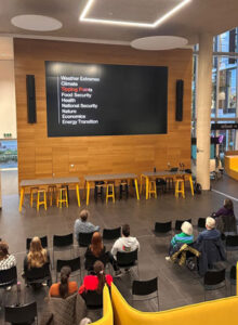 People attend the People's Emergency Briefing film in the Learning Hub in October 2026.
