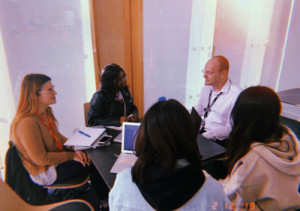 Four students meeting with PR from University of Northampton