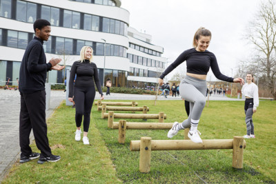 Image by Paul Michael Hughes Photography T 07790819111 UK E pmh@paulmichaelhughes.com W www.paulmichaelhughes.com A student jumping over structures