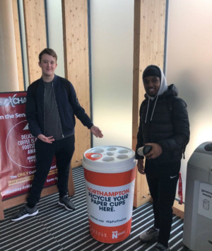 Two students with Up The Cup bin