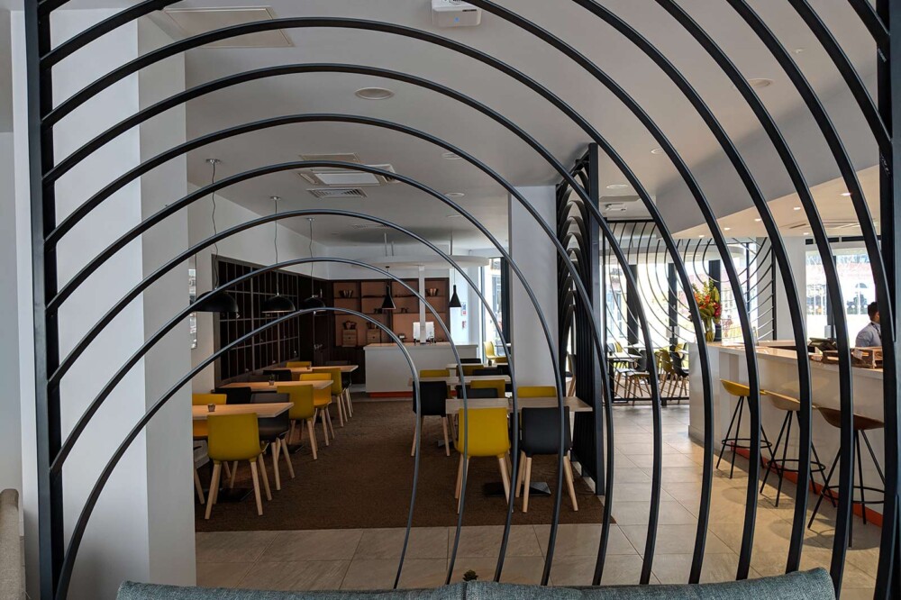 Dining area of Sunley Hotel behind a metal gate design.