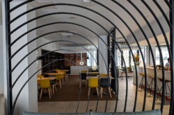 Dining area of Sunley Hotel behind a metal gate design.