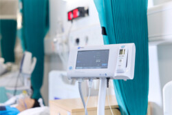 Close up of a heart monitor in the Simulation Lab. It is in a real-life looking Nursing ward.